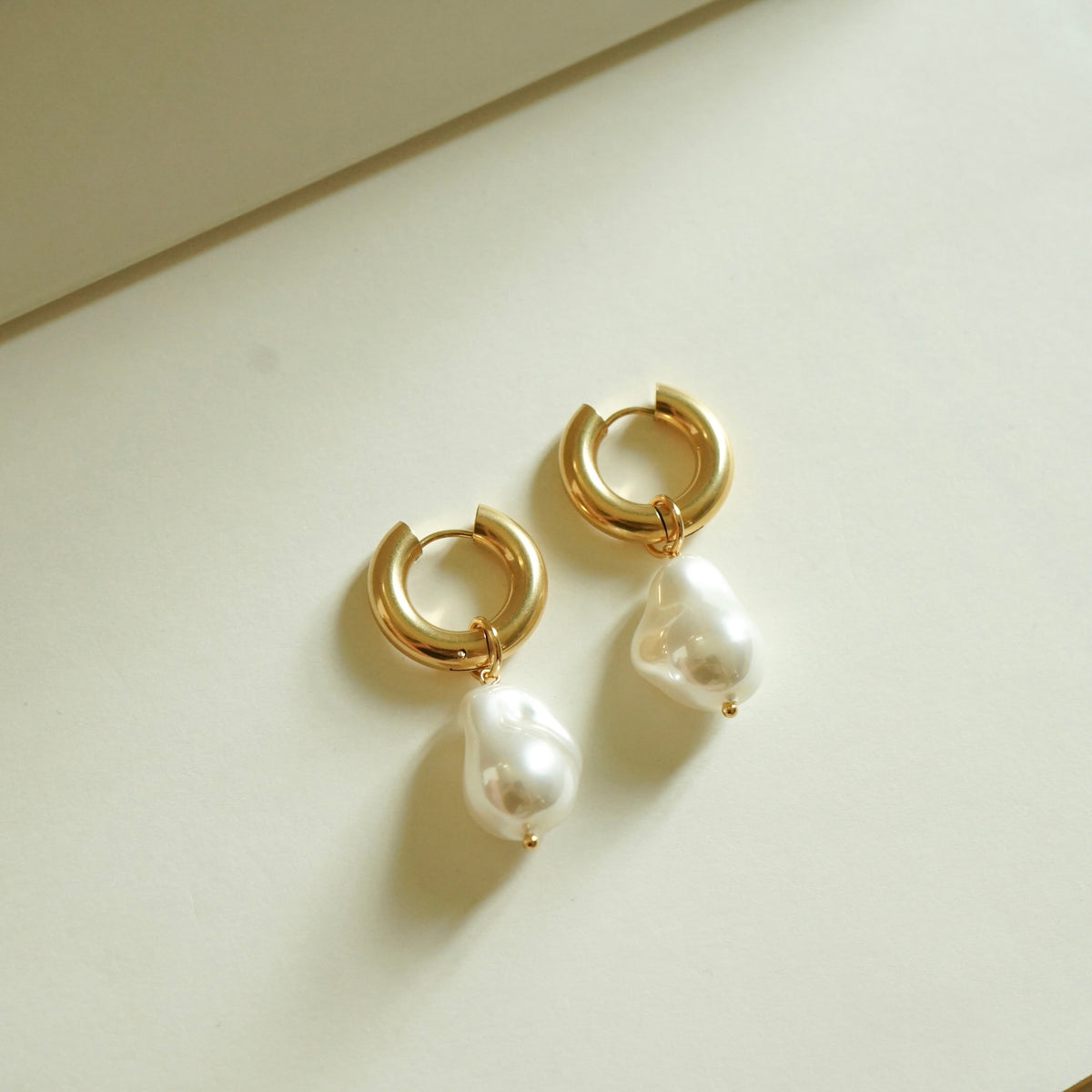 Quinzel Pearl Huggie Earrings