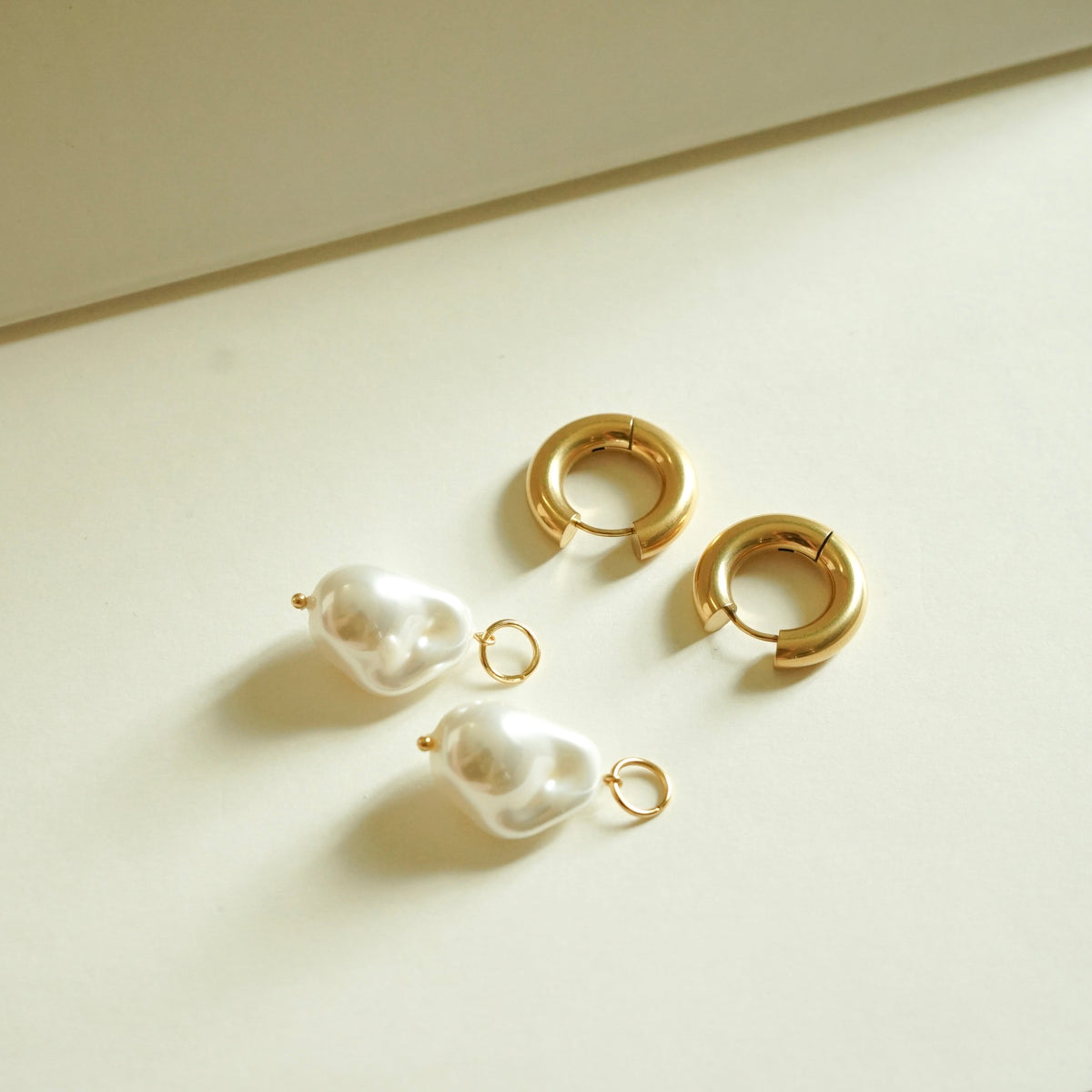 Quinzel Pearl Huggie Earrings